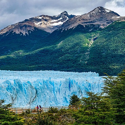 Mountains tower over the Perito Moreno Glacier in Patagonia, Argentina